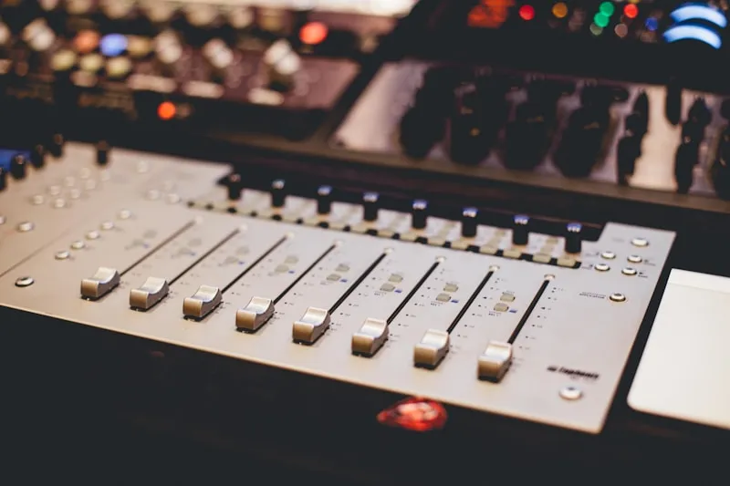 Mixing console with warm studio lighting